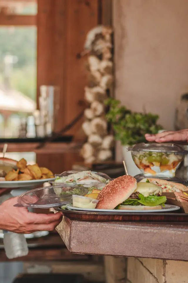 Serving food at Glysteri Beach Bar